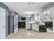 Updated kitchen with white cabinets, granite countertops, stainless steel appliances and an open view of the living room at 6274 Katelyn Park, Lithonia, GA 30058