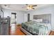 Bright main bedroom features hardwood floors, tray ceiling, and ensuite bathroom at 6274 Katelyn Park, Lithonia, GA 30058