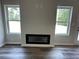 Modern fireplace with sleek black frame flanked by bright windows at 75 Pine Creek Ct, Dallas, GA 30157