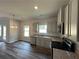 Kitchen with gray cabinets, granite countertops, stainless appliances, and wood-look floors at 75 Pine Creek Ct, Dallas, GA 30157
