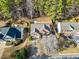 Aerial view of home shows mature trees, landscaping, and manicured lawn at 217 Park Creek Dr, Woodstock, GA 30188