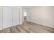 Bedroom features wood-look floors, a spacious closet and neutral paint at 217 Park Creek Dr, Woodstock, GA 30188