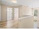 Hallway featuring wood-look floors, neutral paint, and bathroom at end of hall at 217 Park Creek Dr, Woodstock, GA 30188
