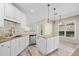 Bright kitchen with white cabinets, stainless steel appliances, and a functional island layout at 217 Park Creek Dr, Woodstock, GA 30188