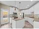 Modern kitchen featuring white cabinets, stainless steel appliances, and a functional kitchen island at 217 Park Creek Dr, Woodstock, GA 30188