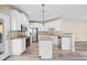 Well-lit kitchen featuring white cabinetry, stainless steel appliances, and a convenient island at 217 Park Creek Dr, Woodstock, GA 30188