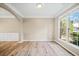 Bright and airy living room with large windows offering ample natural light and wood-look floors at 217 Park Creek Dr, Woodstock, GA 30188