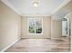 Cozy living room space featuring wood-look flooring, neutral walls, and natural light at 217 Park Creek Dr, Woodstock, GA 30188