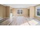 Spacious primary bedroom has natural light and wood-look flooring at 217 Park Creek Dr, Woodstock, GA 30188