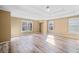 Large main bedroom with tray ceiling, wood-look flooring, and natural light at 217 Park Creek Dr, Woodstock, GA 30188