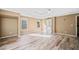 Open primary bedroom with wood-look flooring and bright en-suite bathroom at 217 Park Creek Dr, Woodstock, GA 30188