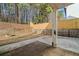 View of the concrete patio and backyard area with a fire pit at 217 Park Creek Dr, Woodstock, GA 30188