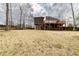 Large backyard featuring a wooden deck, screened-in porch and wooden fence at 4020 F A A Rd, Cumming, GA 30041