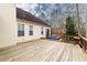 Back of the home featuring a wooden deck with a hot tub and space for outdoor grilling at 4020 F A A Rd, Cumming, GA 30041