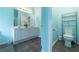 Bathroom featuring a double vanity, toilet and linen closet at 4020 F A A Rd, Cumming, GA 30041