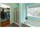 Bright bathroom featuring a soaking tub and separate shower near a large closet at 4020 F A A Rd, Cumming, GA 30041