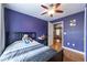 Comfortable bedroom with wood floor, a bed and adjoined space for study and play at 4020 F A A Rd, Cumming, GA 30041