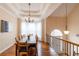 Dining room with coffered ceiling, chandelier, and large window with natural light at 4020 F A A Rd, Cumming, GA 30041