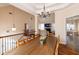 Elegant dining room with a large table, chandelier, and open access to other living areas at 4020 F A A Rd, Cumming, GA 30041