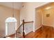 Bright entryway featuring hardwood floors, a white door, and a decorative hanging light fixture at 4020 F A A Rd, Cumming, GA 30041