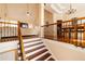 Inviting entryway showcases beautiful hardwood stairs and views into the living and dining areas at 4020 F A A Rd, Cumming, GA 30041