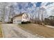 Well-maintained home with a two-car garage and a long driveway at 4020 F A A Rd, Cumming, GA 30041