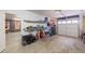 Functional garage with storage shelves, access door, and bright lighting at 4020 F A A Rd, Cumming, GA 30041