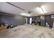 Large garage with ample storage space and access to an interior room at 4020 F A A Rd, Cumming, GA 30041