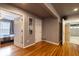 Hallway with hardwood floors and access to bedroom and garage areas at 4020 F A A Rd, Cumming, GA 30041