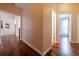 Hallway featuring hardwood floors and multiple doorways at 4020 F A A Rd, Cumming, GA 30041