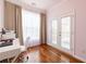 Cozy home office with hardwood floors, a large window, and access to the outdoor deck at 4020 F A A Rd, Cumming, GA 30041