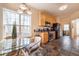 Bright kitchen featuring light wood cabinetry, black appliances, and an adjacent breakfast nook at 4020 F A A Rd, Cumming, GA 30041