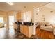 Well-lit kitchen area, offering a view into a living space with comfortable furnishings at 4020 F A A Rd, Cumming, GA 30041