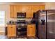 Kitchen featuring stainless steel appliances, granite countertops, and maple cabinets at 4020 F A A Rd, Cumming, GA 30041
