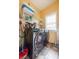 Practical laundry room equipped with modern front load washer and dryer for efficient cleaning at 4020 F A A Rd, Cumming, GA 30041