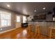 Finished room with hardwood floors, wet bar, exterior access and recessed lighting at 4020 F A A Rd, Cumming, GA 30041