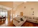 Inviting living room with hardwood floors, high ceilings, and a comfortable beige sectional sofa at 4020 F A A Rd, Cumming, GA 30041
