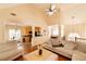 Open living space with hardwood floors connecting the kitchen, breakfast nook, living room, and dining room at 4020 F A A Rd, Cumming, GA 30041