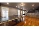 Finished basement recreation room with a ping pong table, bar, and hardwood floors at 4020 F A A Rd, Cumming, GA 30041