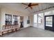 Inviting screened-in porch with fan, view of yard and doorway to interior at 4020 F A A Rd, Cumming, GA 30041