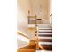 Staircase features wood treads and a neutral color palette, creating a bright and welcoming space at 4020 F A A Rd, Cumming, GA 30041