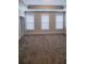 Large carpeted bedroom with tray ceiling and lots of natural light at 4191 Wisconsin Dr, Dunwoody, GA 30338