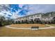 Townhouse community featuring a manicured green space and walking paths at 4191 Wisconsin Dr, Dunwoody, GA 30338