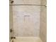 Modern shower with white marble tiling and a built in shower niche at 4191 Wisconsin Dr, Dunwoody, GA 30338