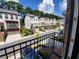 Exterior street view of a townhouse community with manicured lawns and garages at 4191 Wisconsin Dr, Dunwoody, GA 30338