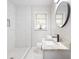 Modern bathroom features granite countertop, sleek fixtures, and tiled walk-in shower at 4611 Old Westside Rd, Austell, GA 30106