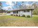 Attractive single-story house featuring a neat lawn and classic black shutters at 4611 Old Westside Rd, Austell, GA 30106