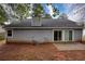 Exterior of house with siding, sliding glass doors, and some patio space for outdoor enjoyment at 4938 Terrace Green Trce, Stone Mountain, GA 30088