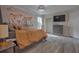 Stylish bedroom with hardwood floors, a comfortable bed, and modern decor at 4938 Terrace Green Trce, Stone Mountain, GA 30088