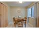 Cozy dining area with a window view and a classic wooden table set at 4938 Terrace Green Trce, Stone Mountain, GA 30088